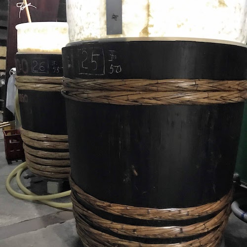 Form shades attached to wooden tanks